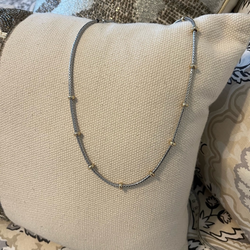 Free with purchase only. Silver necklace either gold bead stations.